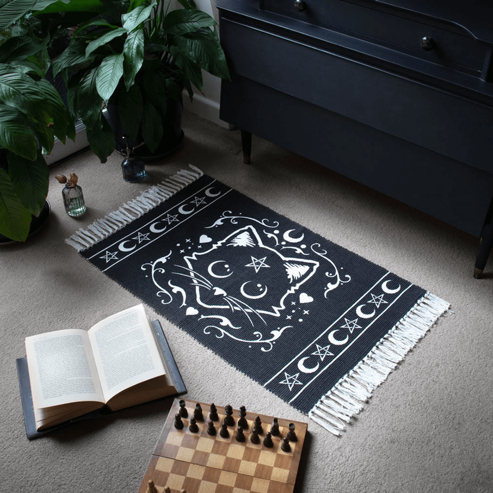 Purrfect black cat rug with moon and star design, perfect for witchy spaces and altars.