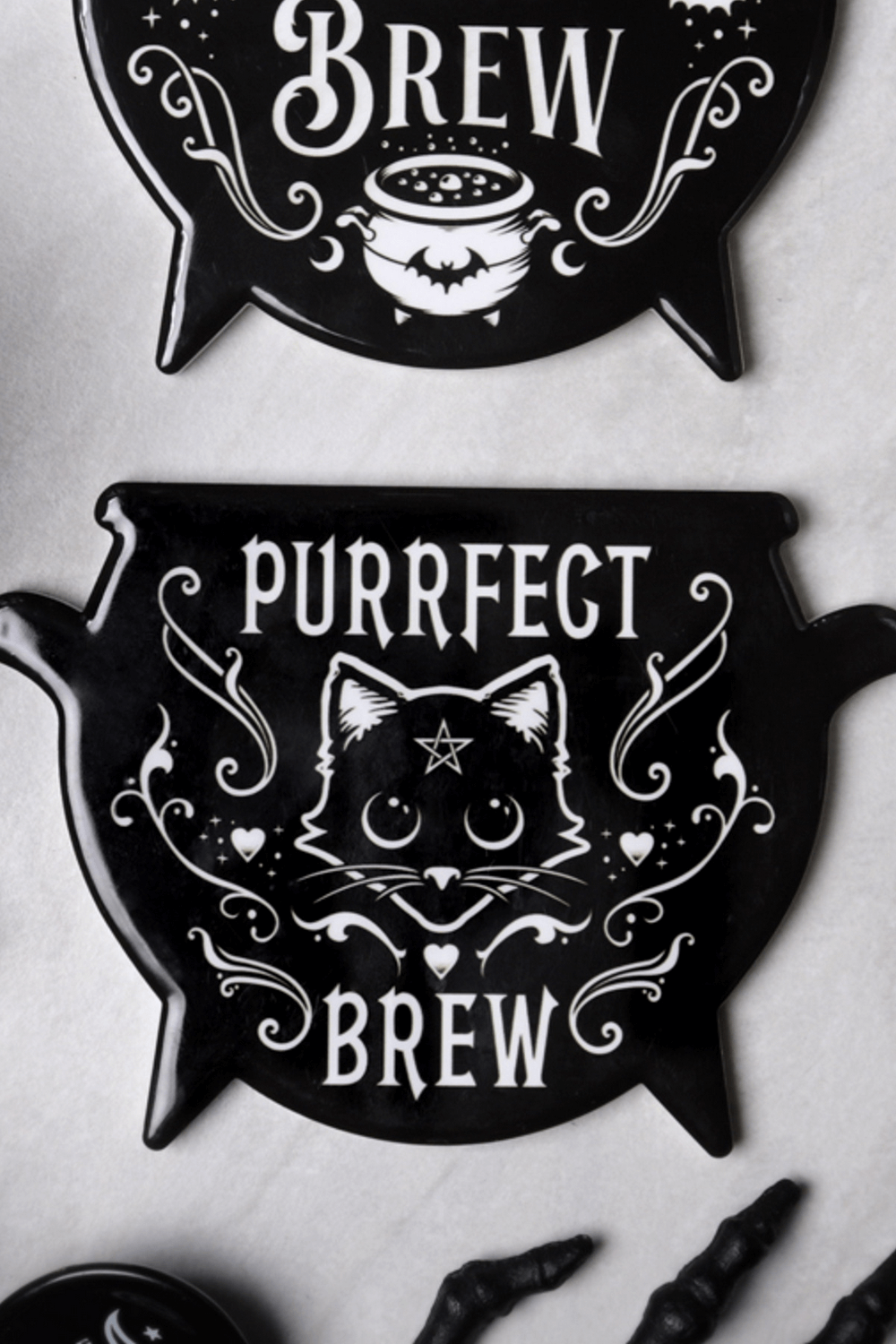 Purrfect Brew Gothic Cat Cauldron Coaster by Alchemy, featuring a whimsical cat design for witchy home decor.