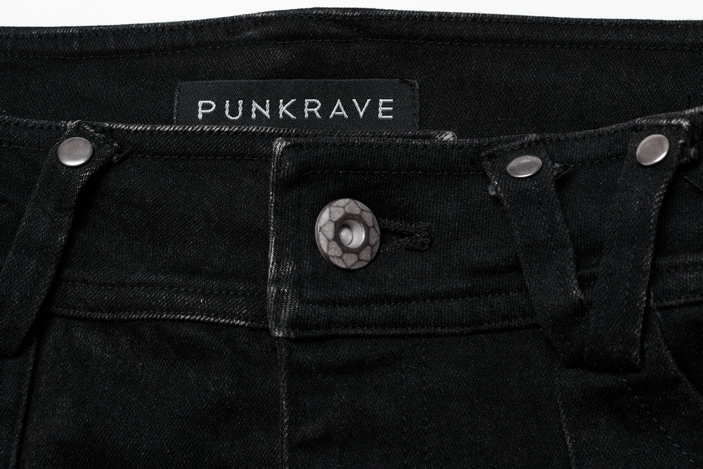 Close-up of Punkrave Ragged Mesh Splice Trousers showcasing button and tag detail for edgy punk fashion.