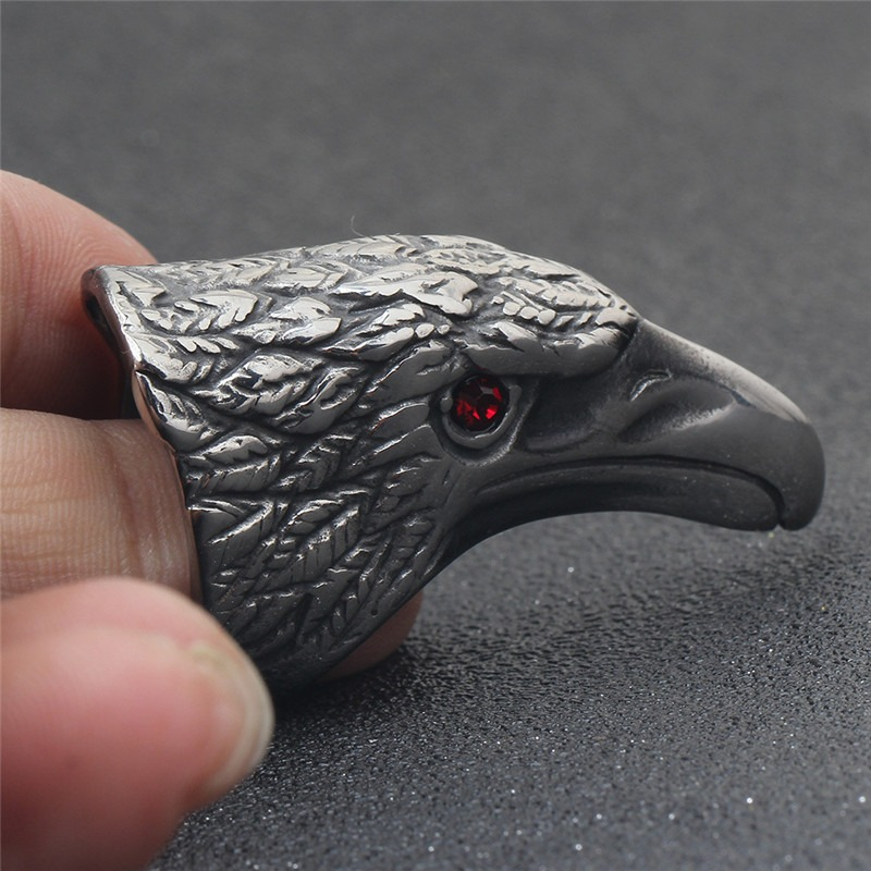 Close-up of Raven's Head stainless steel ring with red eye detail, perfect for gothic fashion and cosplay.