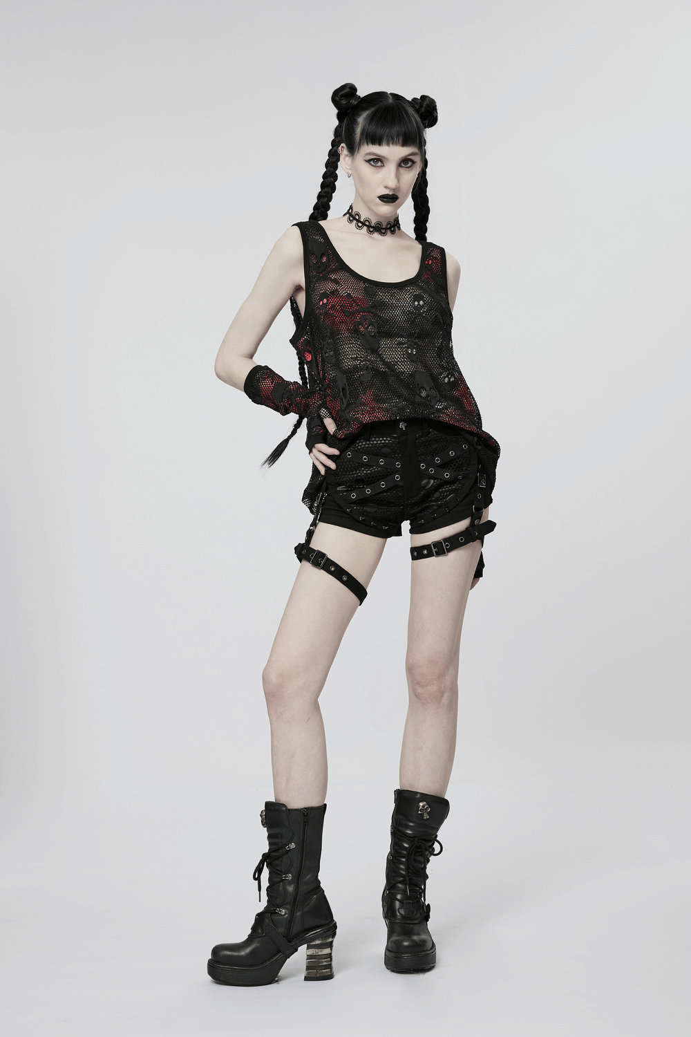 Model showcasing Rebel Skull Mesh Overlay Tank and Fingerless Gloves, styled with edgy accessories and bold footwear.
