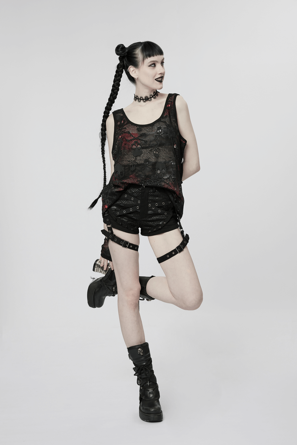 Model wearing Rebel Skull Mesh Overlay Tank with fingerless gloves, styled in edgy punk fashion.