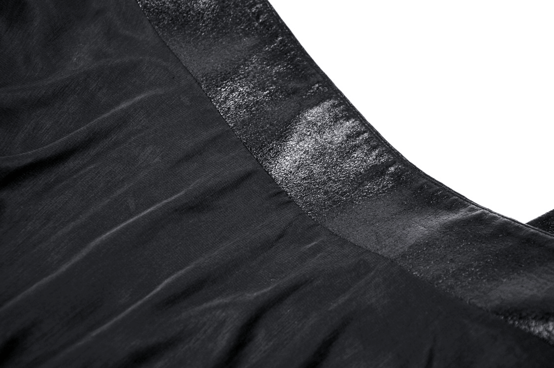 Close-up view of the sleek black fabric and shiny waistband of a gothic mini skirt.