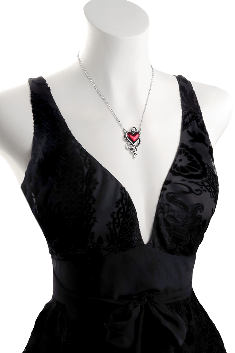 Elegant red devil heart pendant necklace showcased on a stylish black dress, perfect for gothic fashion lovers.