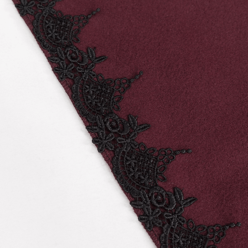 Close-up of red fabric with intricate black lace trim, perfect for gothic fashion.