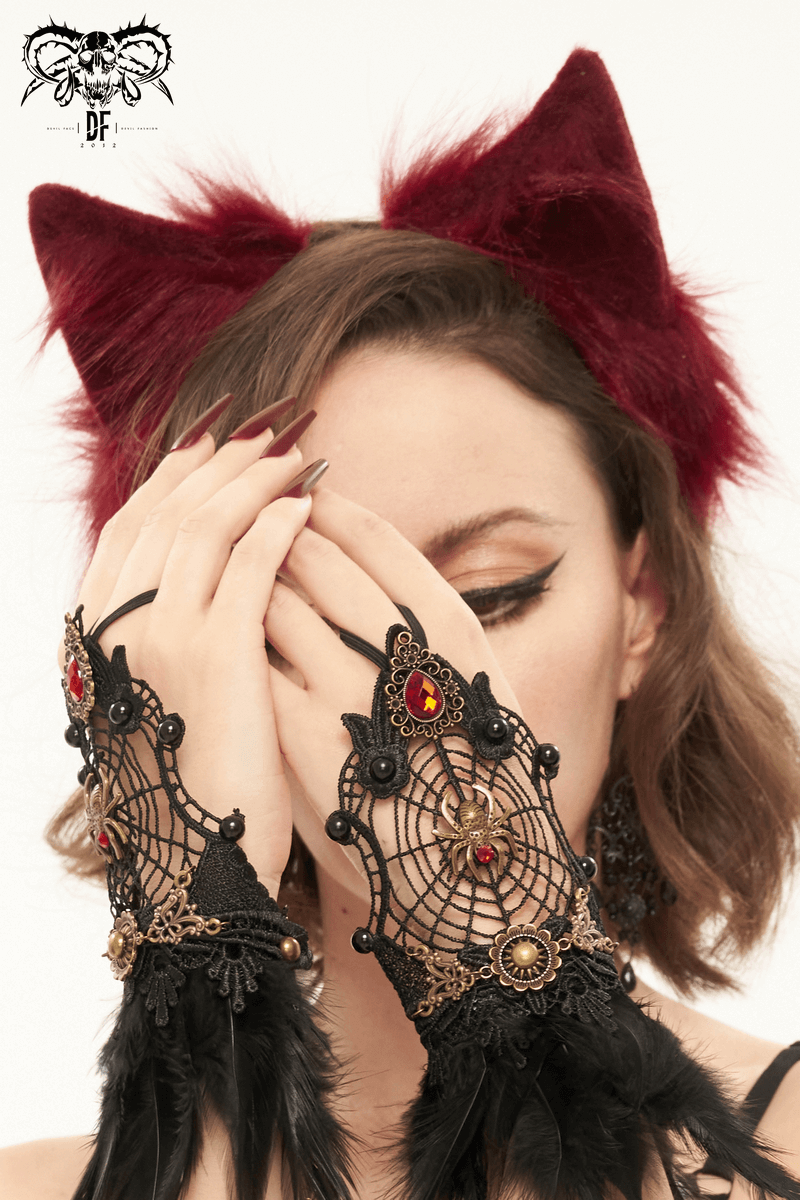 Model wearing red faux fur cat ears headdress and black gothic lace gloves with ornate designs.