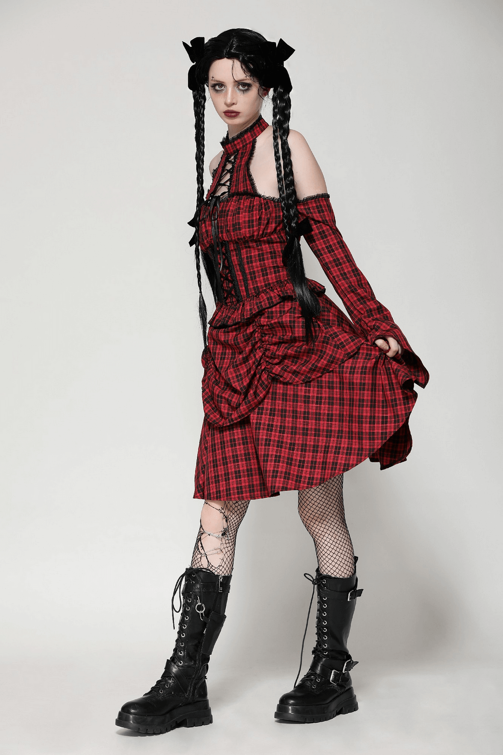 Red plaid gothic corset dress with off-shoulder sleeves and ruffle details, styled for a modern gothic look.