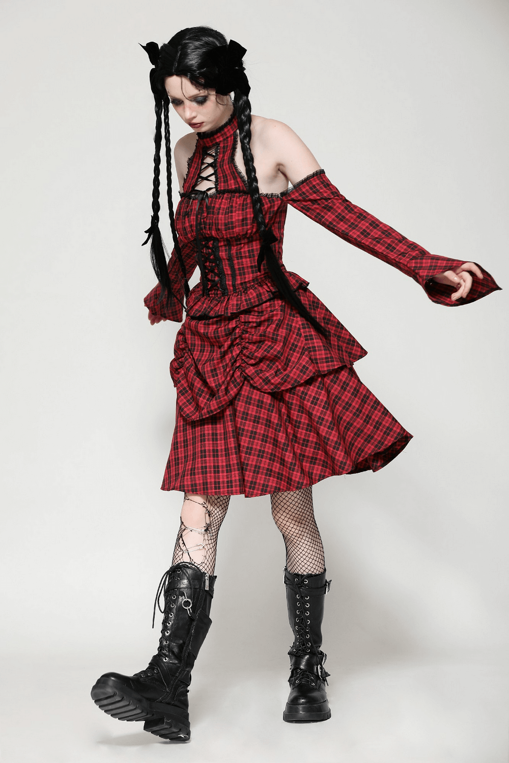 Red plaid gothic corset dress with ruffle details, off-shoulder style, and lace-up front, perfect for a modern Victorian look.