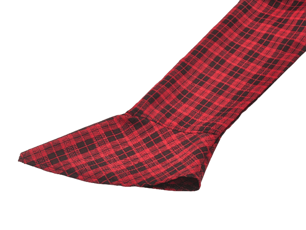 Close-up of the ruffled hem of a red plaid gothic corset dress, showcasing its stylish tartan pattern and elegant design.