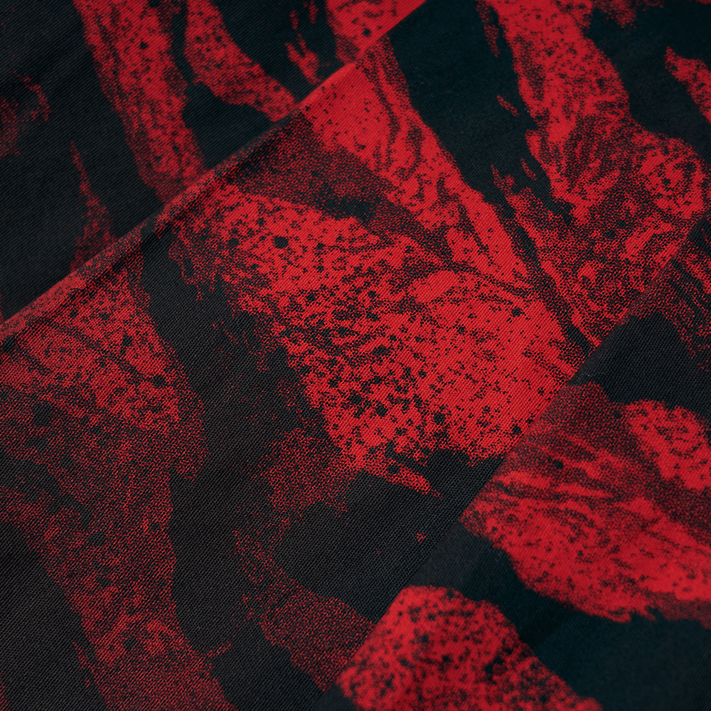 Close-up of abstract red and black print fabric for punk A-line skirt, showcasing artistic flair and unique patterns.