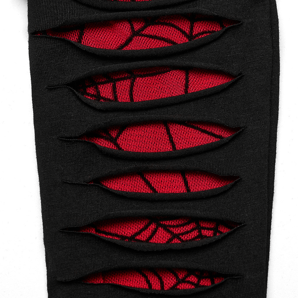 Close-up of red-weave goth gloves with spider mesh splice, showcasing unique cut and daring design.
