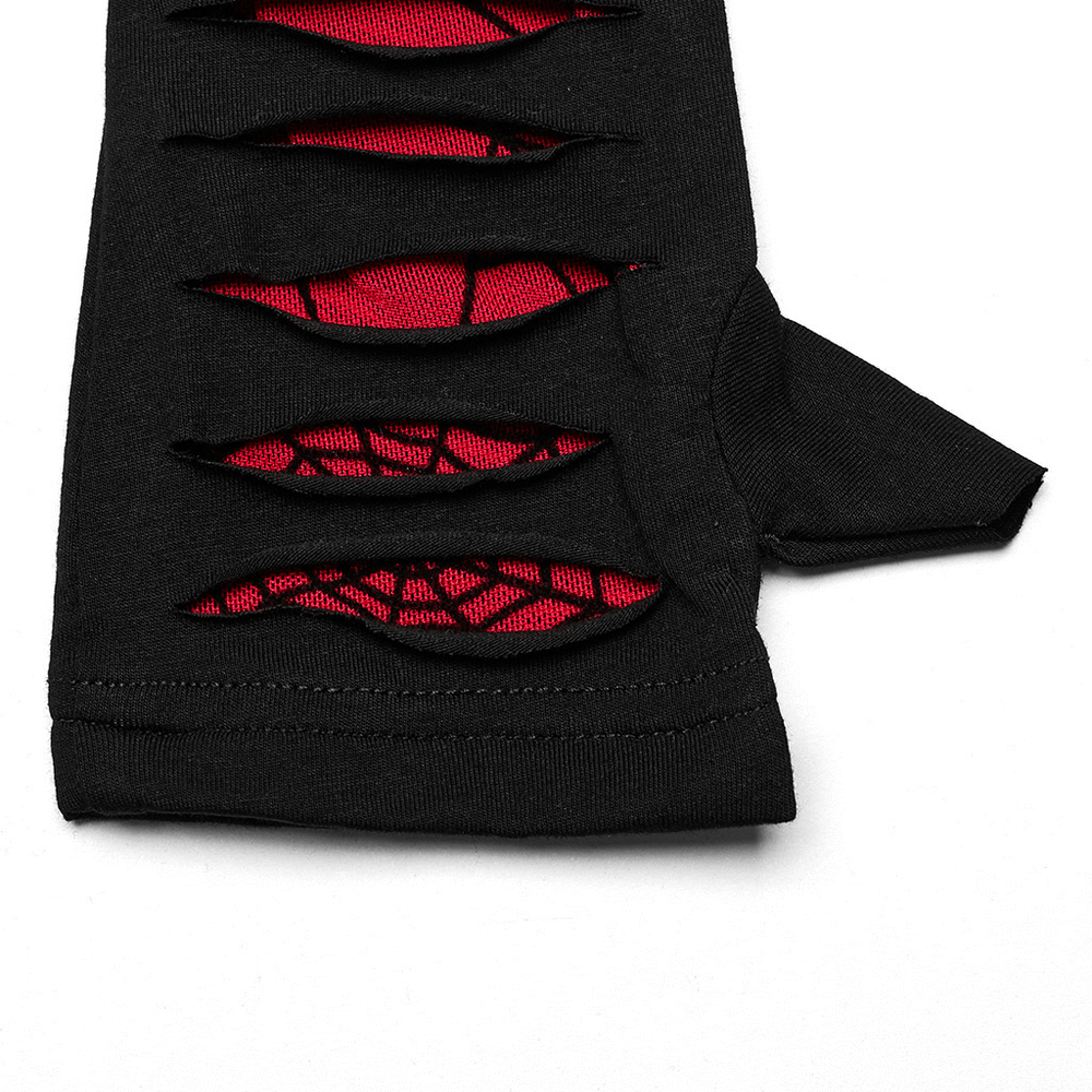 Close-up of red-weave goth gloves with spider mesh splices and unique cut design, showcasing bold dark fashion.