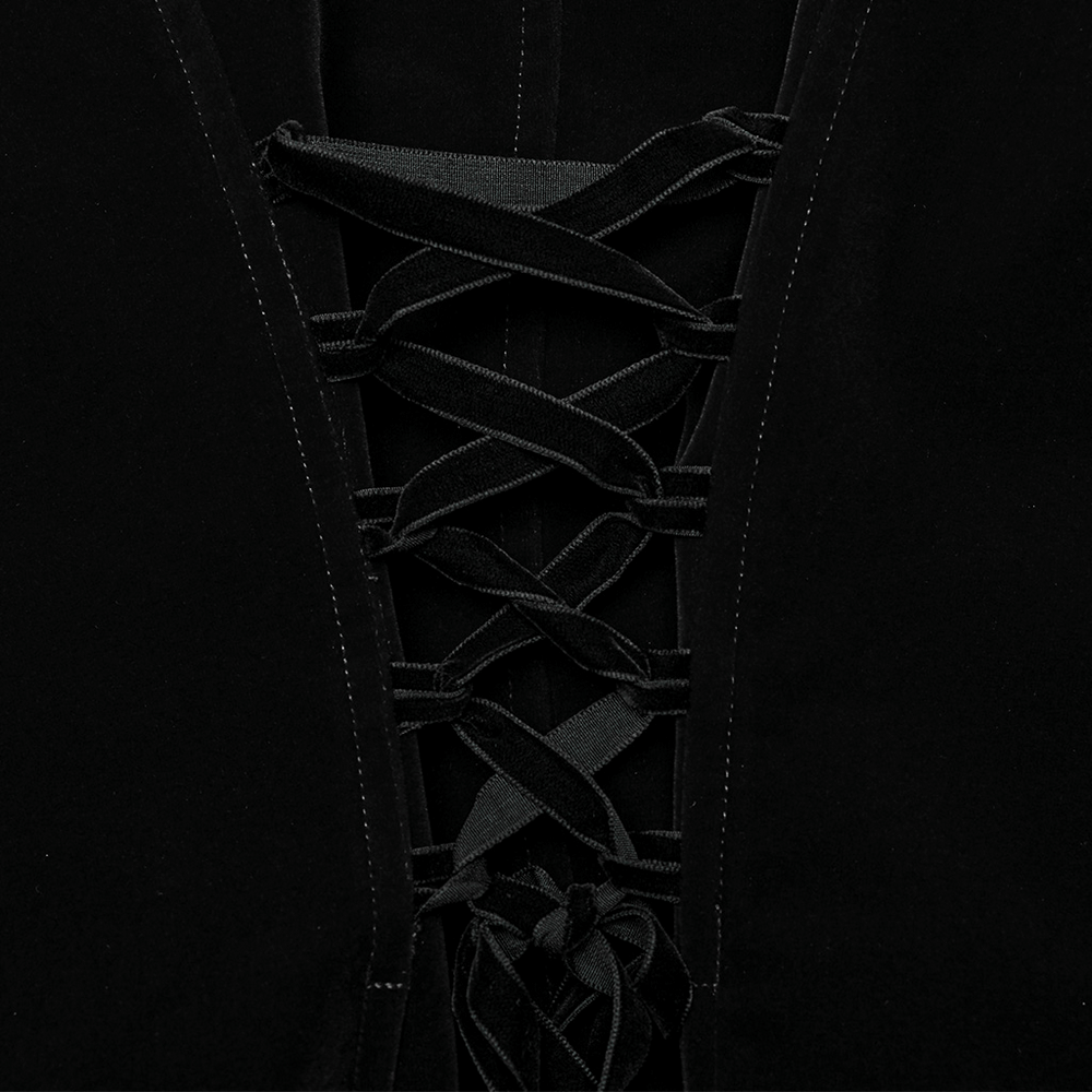 Close-up of intricate lace-up detail on a refined black velvet jacket, showcasing gothic elegance and craftsmanship.