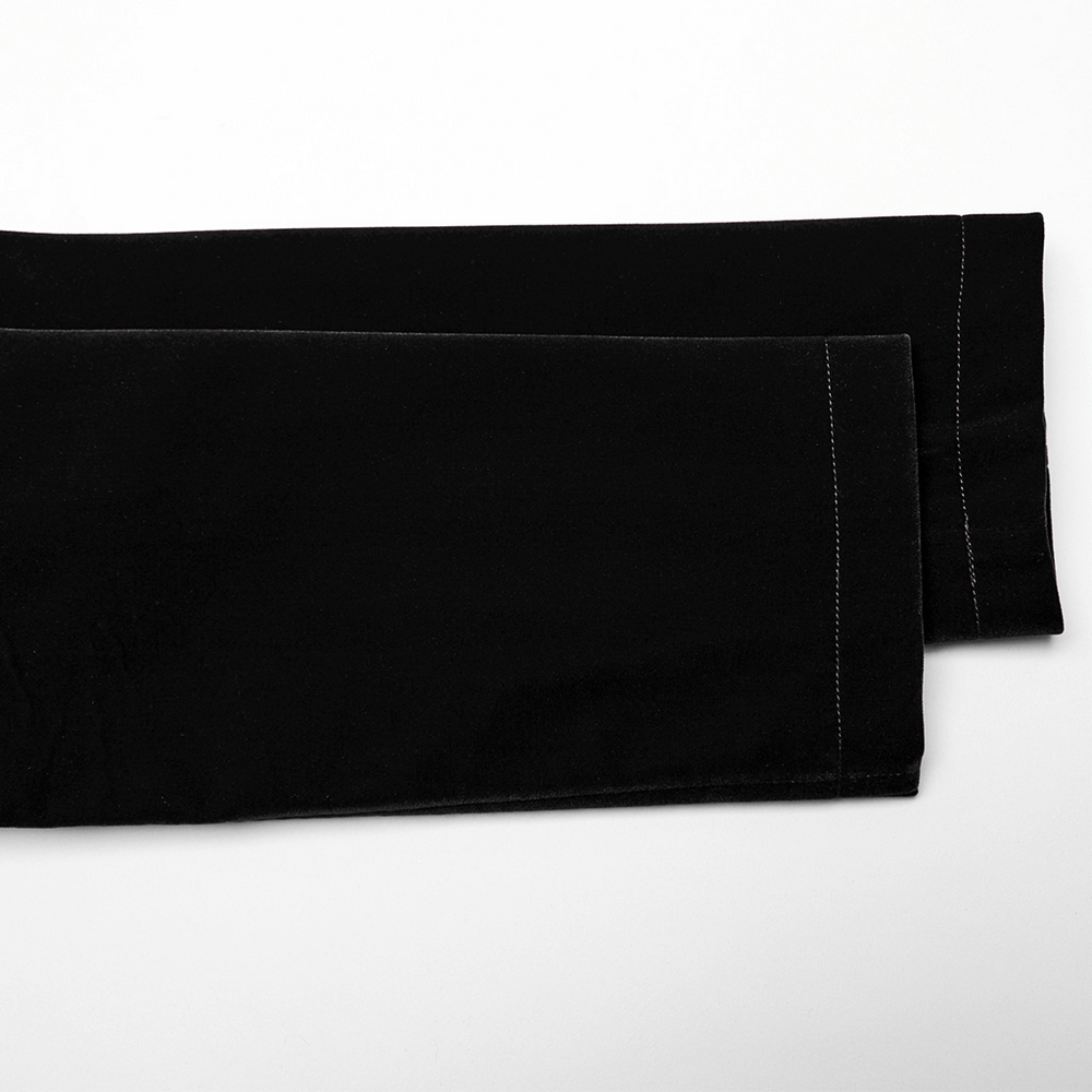 Close-up of elegant black velvet fabric for gothic fashion, showcasing soft texture and refined detailing.