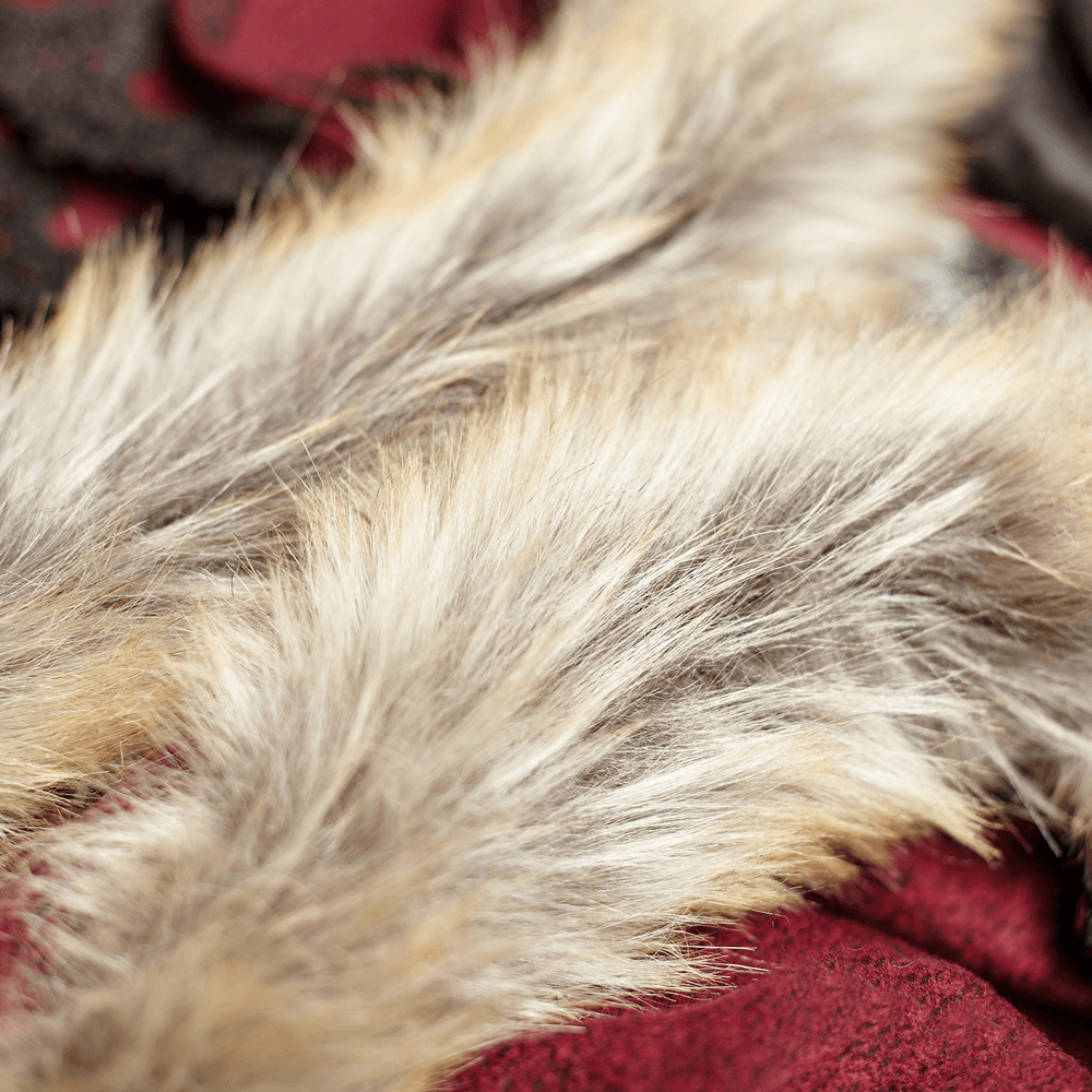 Close-up of luxurious faux fur trim in shades of cream and brown, enhancing the gothic cloak's regal appeal.