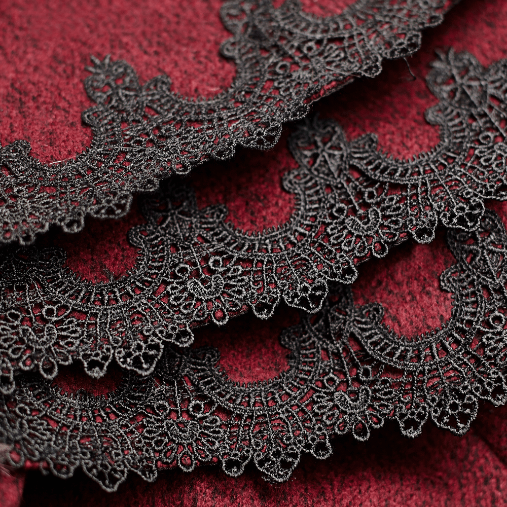 Close-up of intricate black lace trim on luxurious wine red fabric, adding elegance to Gothic fashion.
