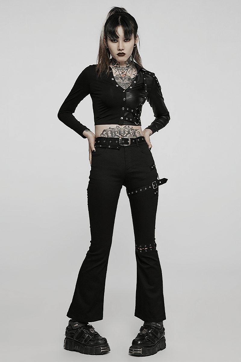 Chic black flared pants with removable belt, embodying punk style, worn by a model with tattoos and edgy accessories.