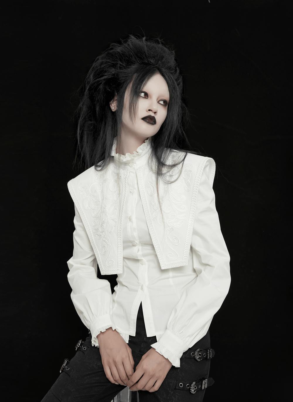 Model wearing a Retro Gothic White Ruffled Shirt with Wide Shoulders and 3D lace collar, styled with edgy makeup.