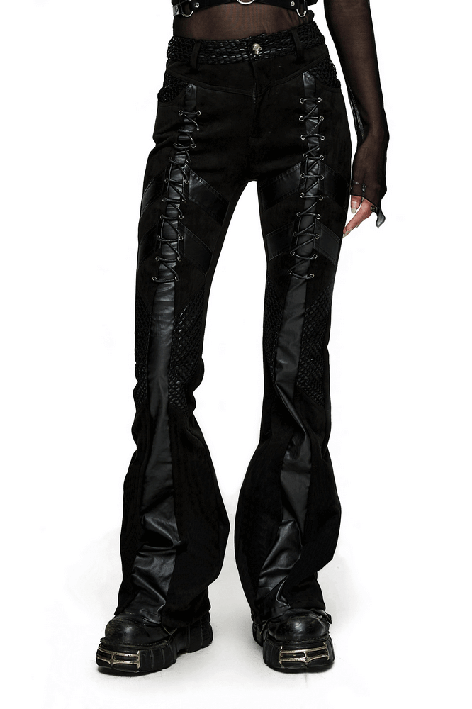 Retro punk flared trousers with eyelet lace-up detail and sleek black design, showcasing gothic style and edgy fashion.