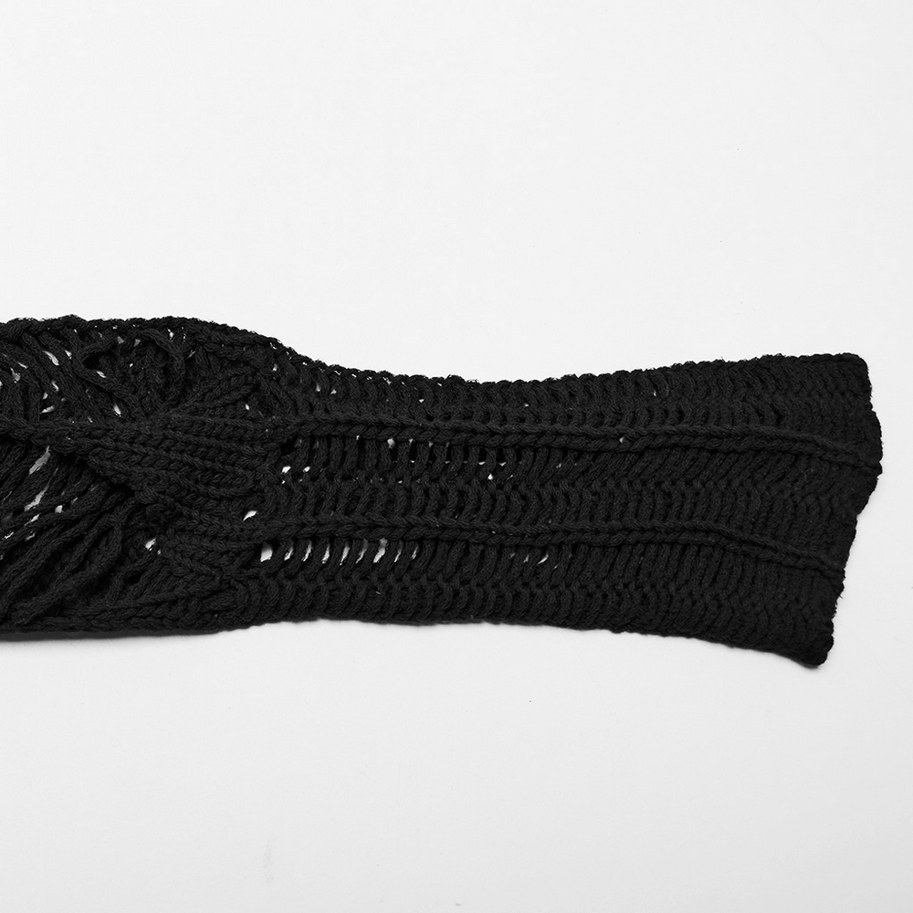 Close-up of a ripped black gothic punk long sleeve sweater showcasing intricate hollow knit details.