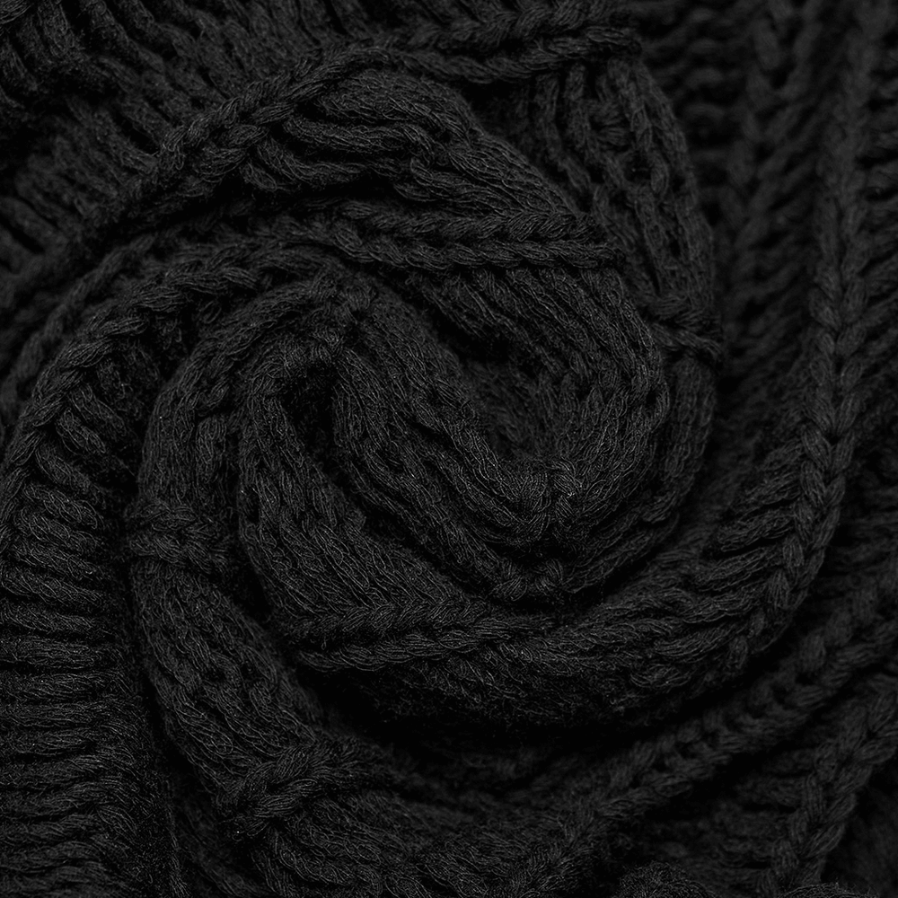 Close-up of soft black knitted fabric, showcasing the texture and weaving of a gothic punk long sleeve sweater.