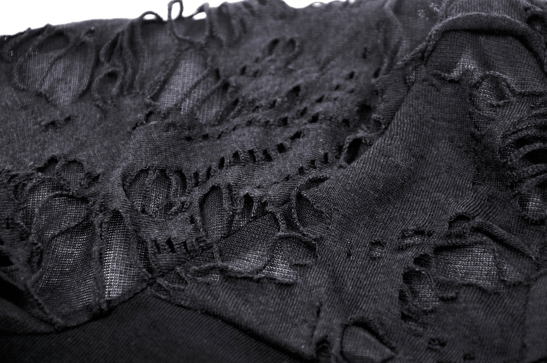 Close-up of the ripped details on a black crop top, showcasing edgy fashion with a touch of rockstar flair.