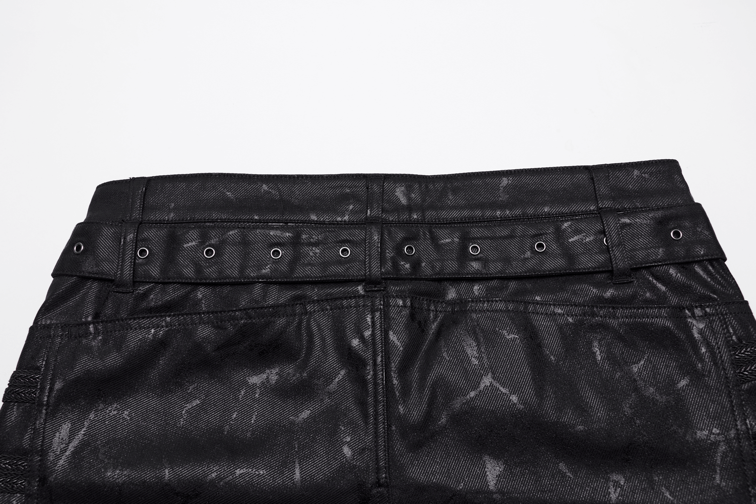 Close-up of Rivet-Side Embellished Punk Rock Jeans waistband, showcasing studded detailing and stylish design.