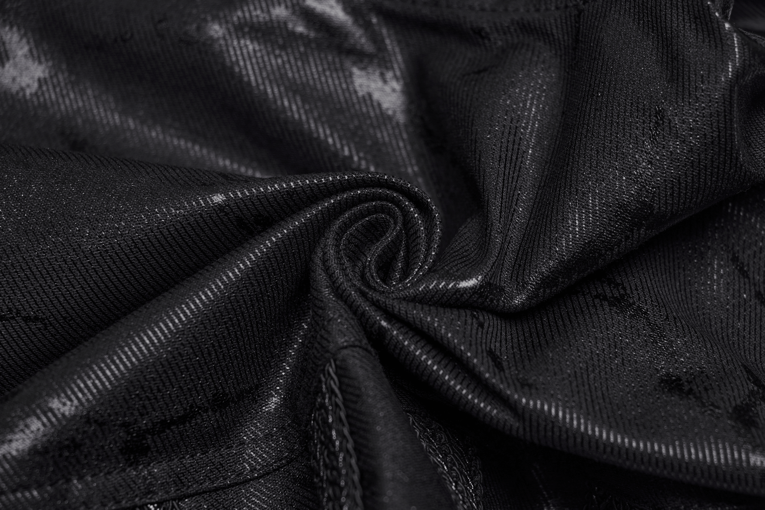 Close-up of the sleek, black fabric used in rivet-side embellished punk rock jeans for men.