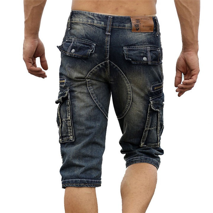 Back view of rock style men's cargo shorts in washed denim with multiple pockets, perfect for summer casual wear.