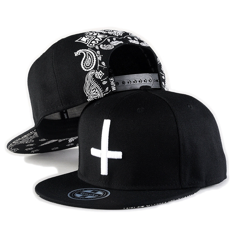 Rock style black snapback baseball cap with cross embroidery and paisley design on the brim, perfect for casual wear.
