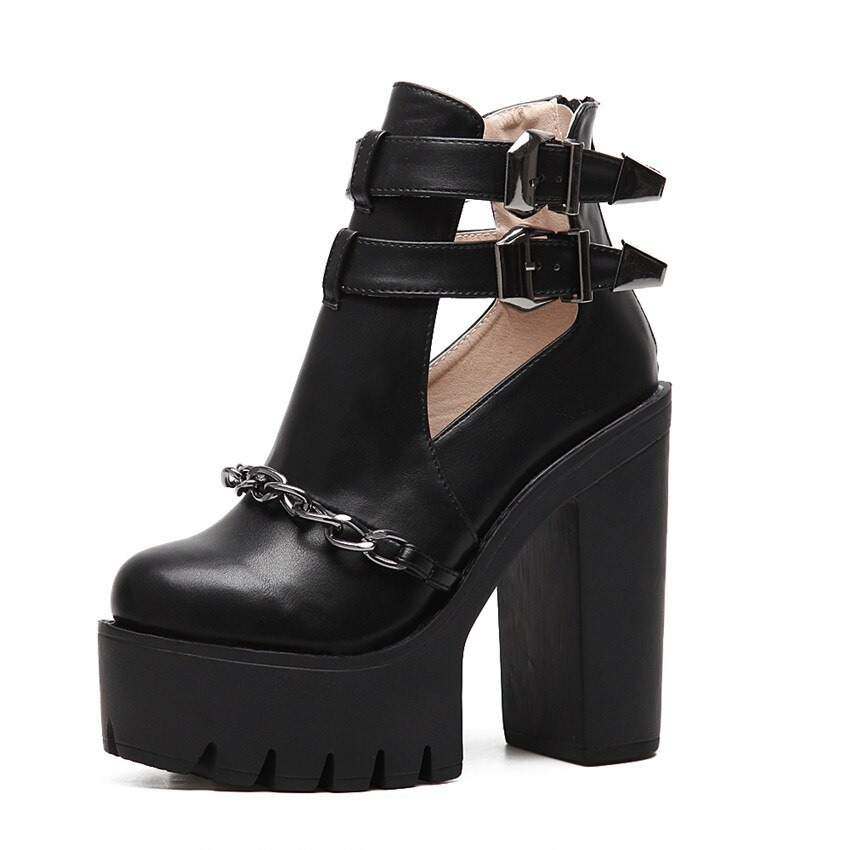Stylish black high heel boots with thick platform, chain detail and buckle straps for rock-inspired outfits.