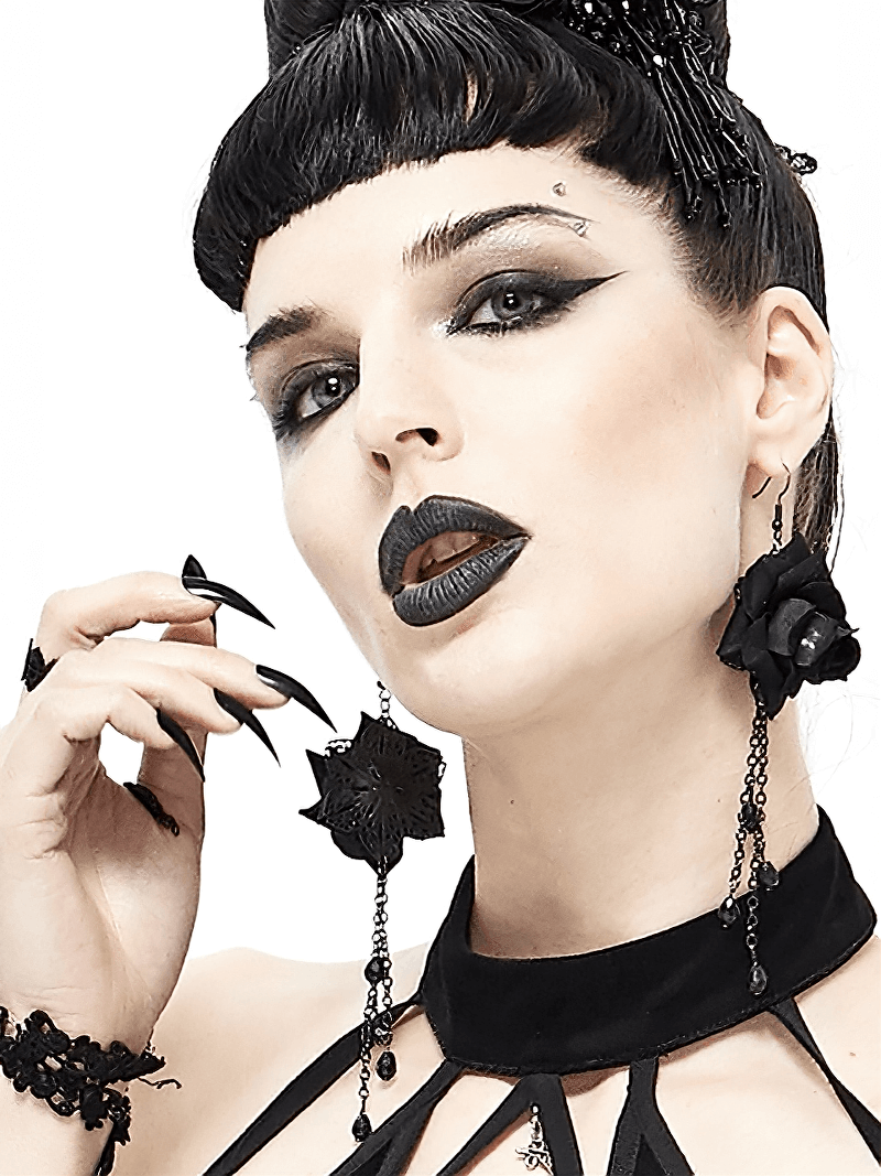 Gothic style model showcasing black rose earrings with chains, perfect for alternative fashion lovers.