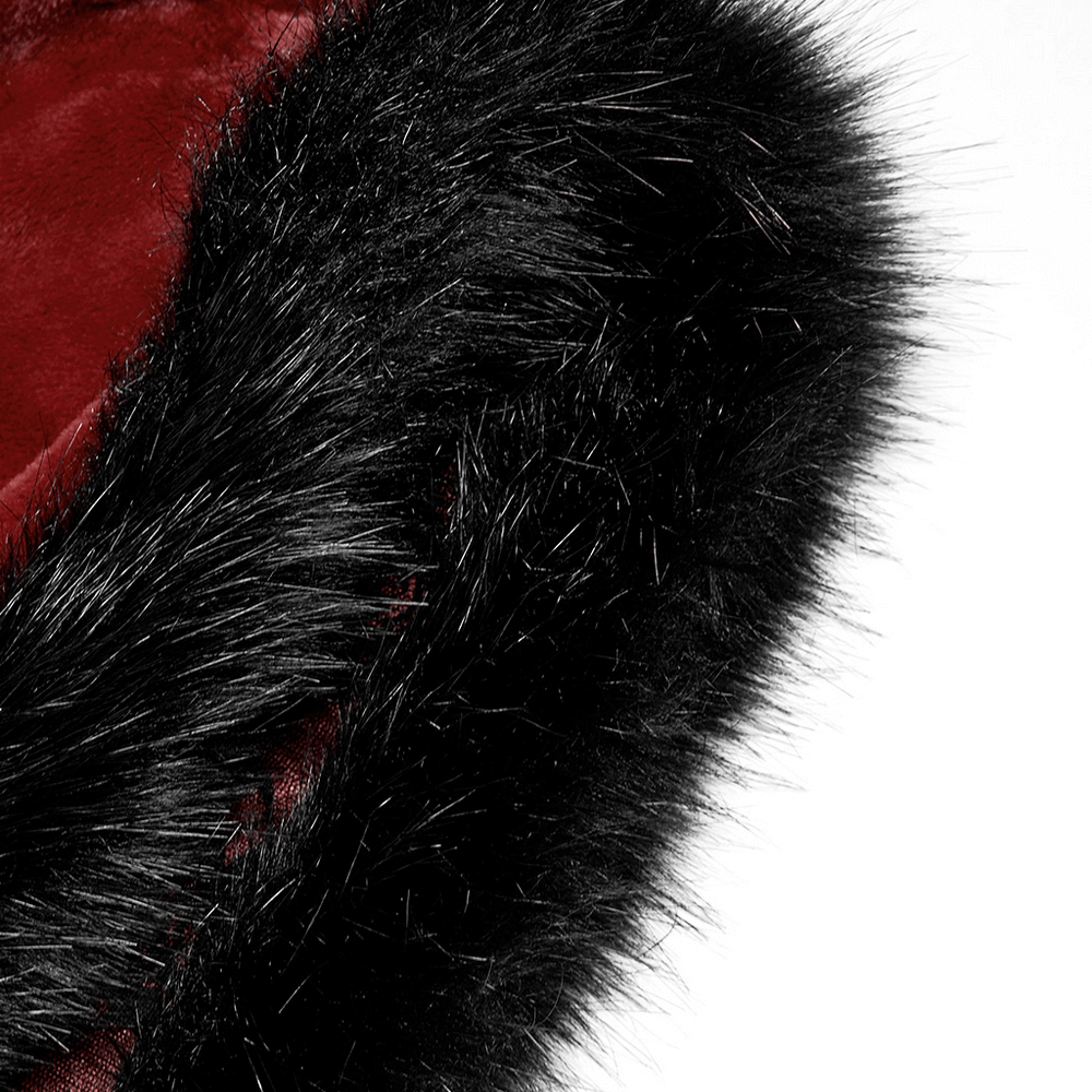 Close-up of plush black faux fur trim on a luxurious red velvet cloak for women.
