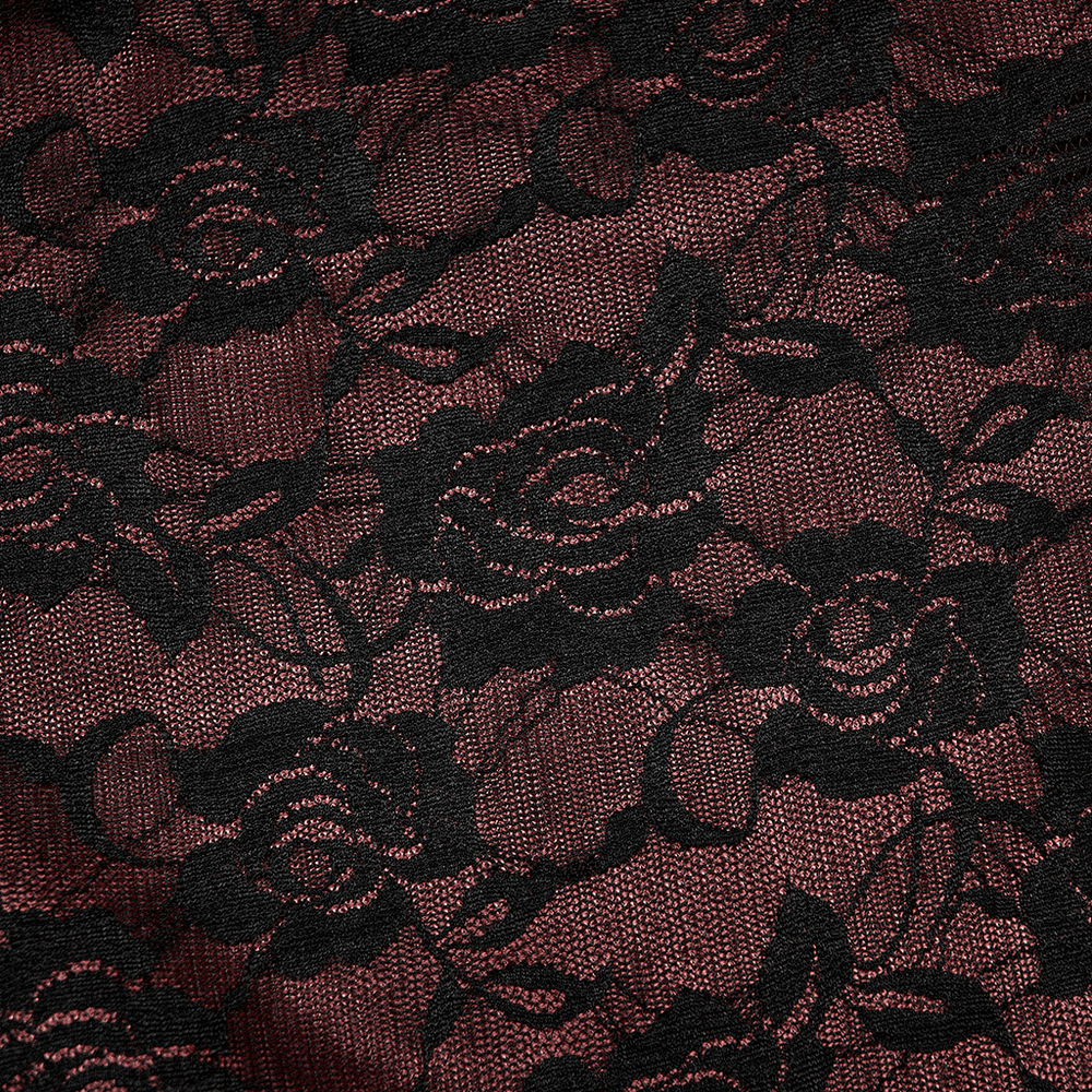 Elegant black floral lace over rich burgundy fabric, perfect for Gothic fashion and opulent designs.