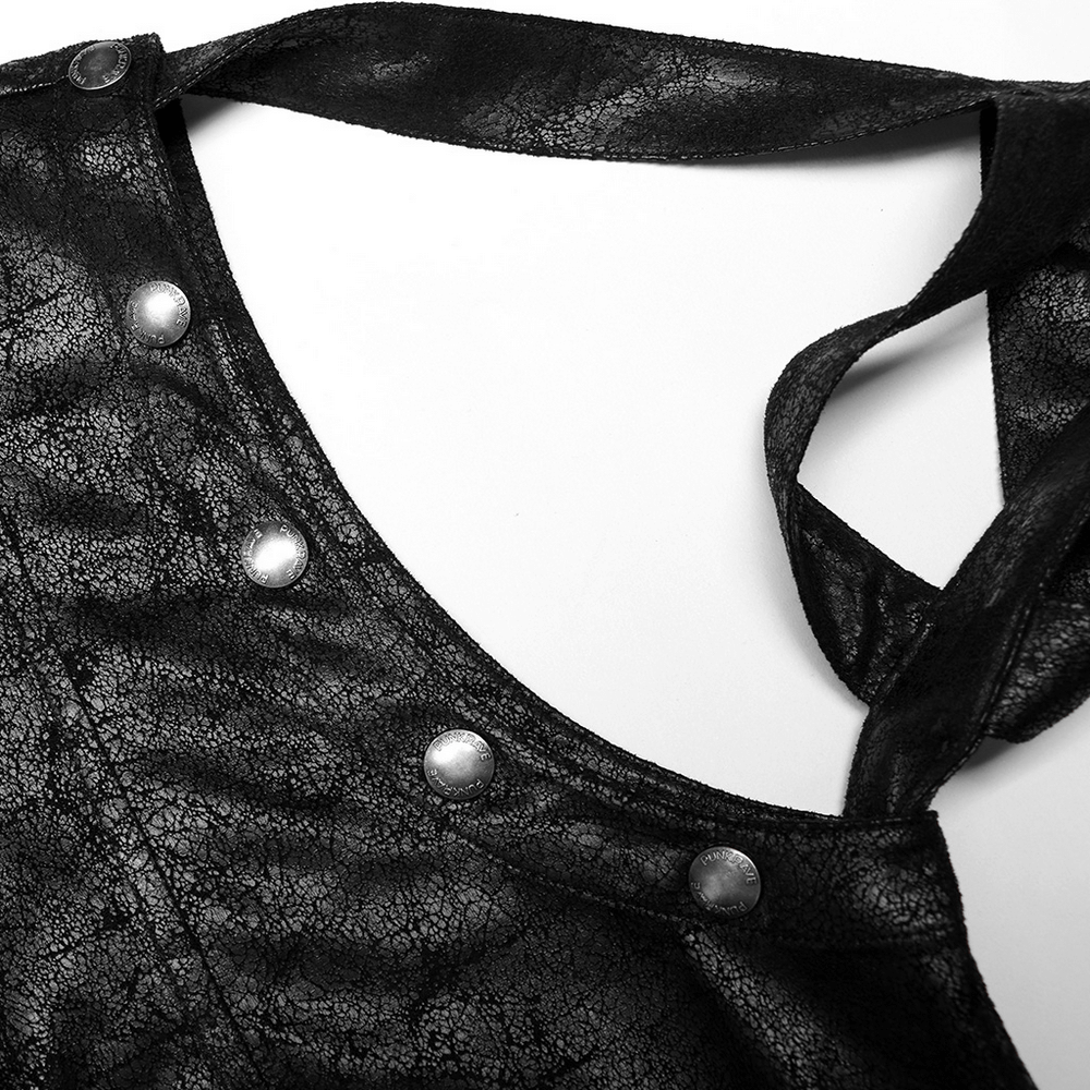 Close-up of black rubberized fabric with metallic snaps on a punk longline coat's strap, showcasing unique design details.