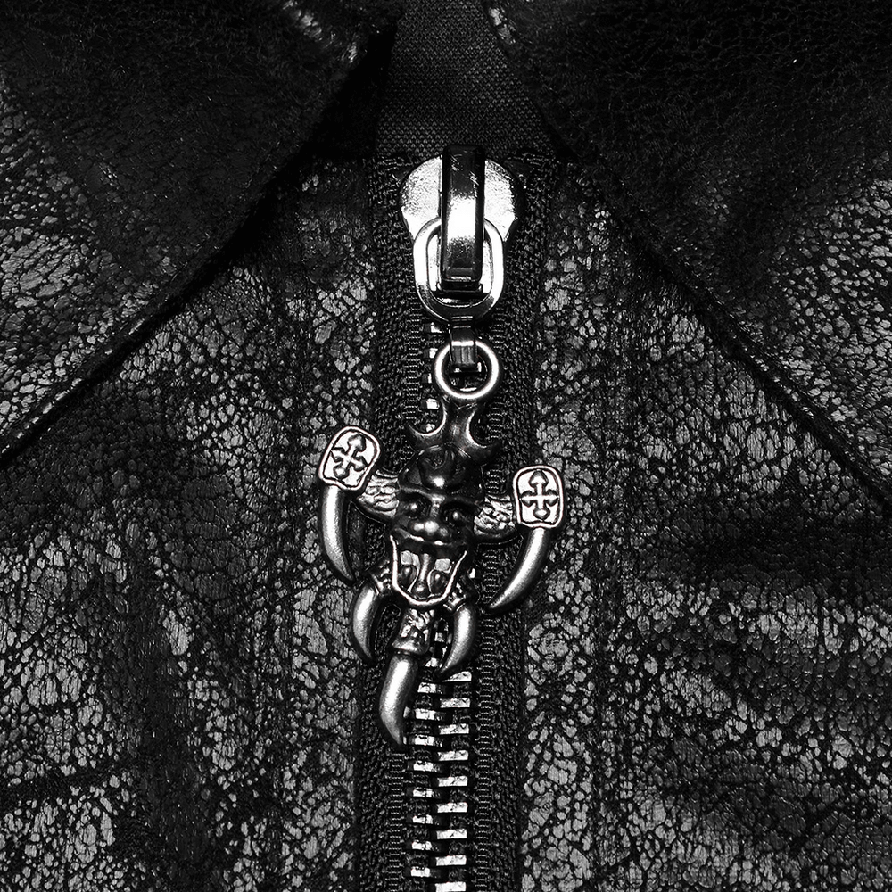 Close-up of a unique zip pull featuring a punk-style charm on a textured black coat.