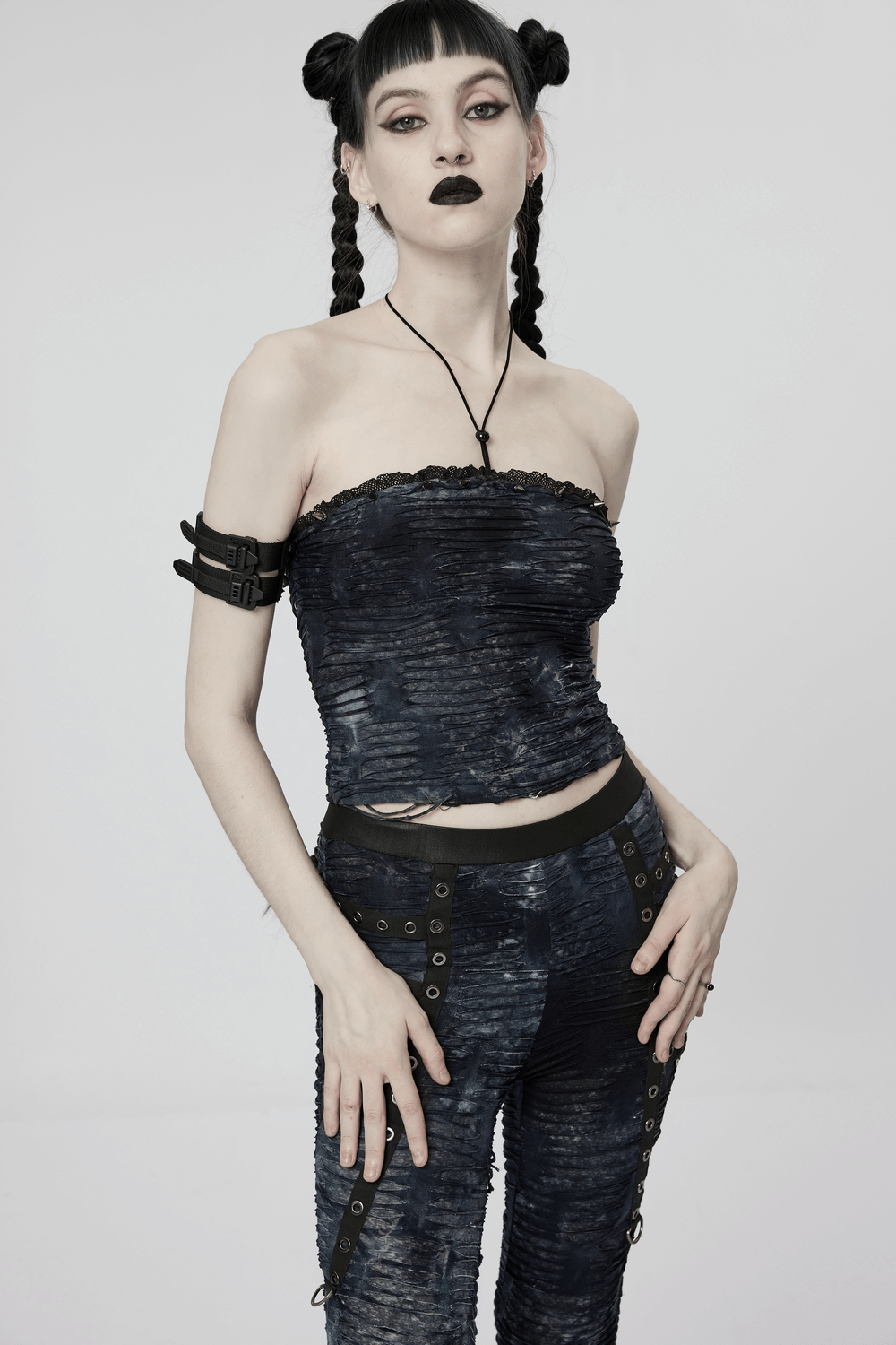 Model wearing a ruched gothic bustier camis with lace and rivets, styled for a bold punk statement.