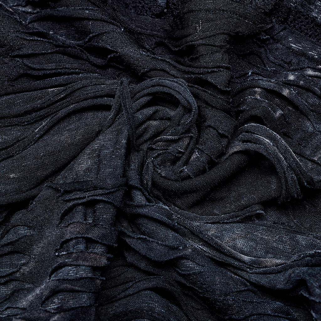 Close-up of ruched black fabric, showcasing a textured, gothic design perfect for a bold bustier.