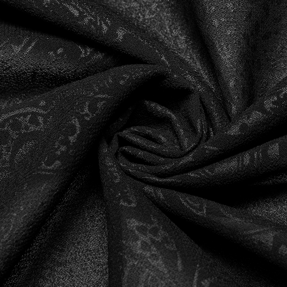 Close-up of soft black chiffon fabric with intricate gothic patterns, perfect for stylish designs.