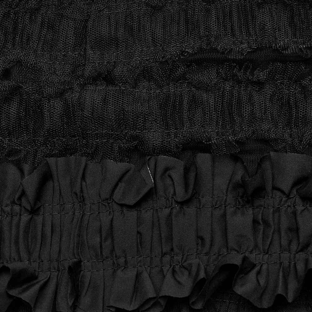 Close-up of the layered black ruffles on a gothic skirt, showcasing unique mesh and woven textures.