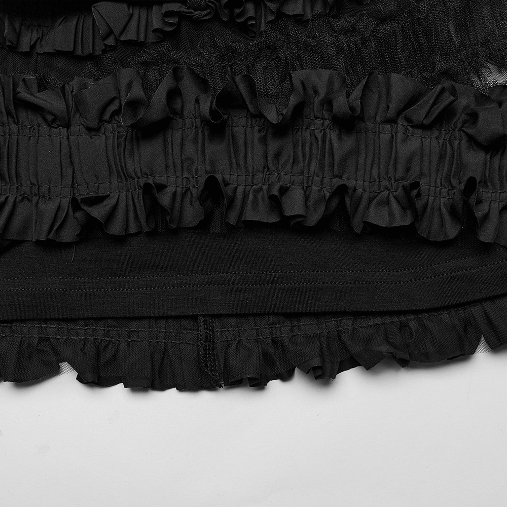 Ruffled gothic skirt detail with layered mesh and woven ruffles in black, showcasing unique texture and style.