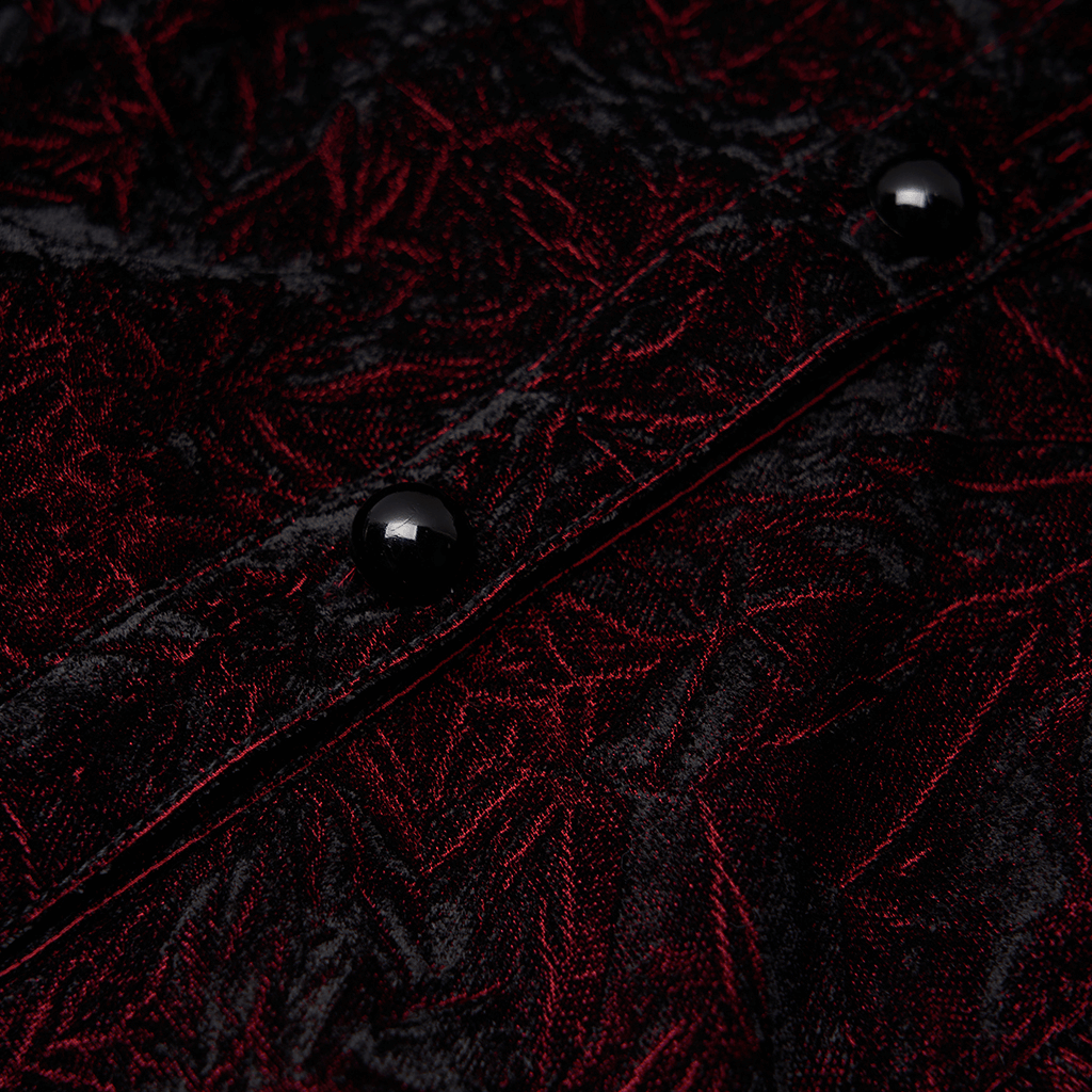 Close-up of ruffled velvet fabric on Gothic blouse, showcasing intricate patterns and black buttons.