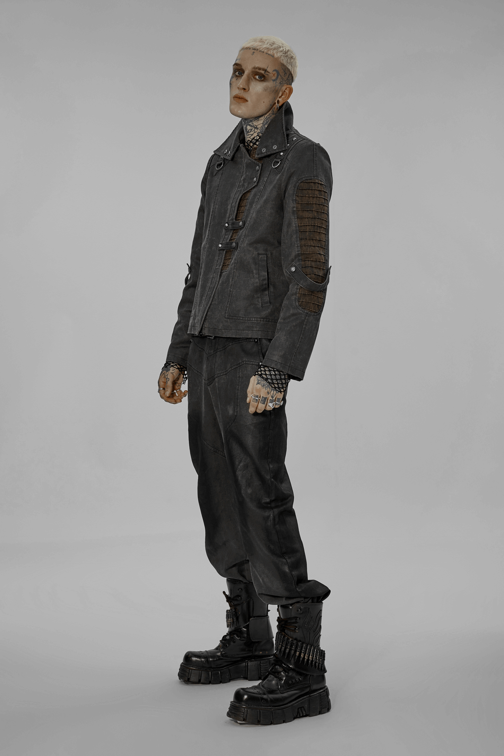 Edgy post-apocalyptic style jacket showcasing distressed faux leather and unique sleeve loops, perfect for urban fashion.