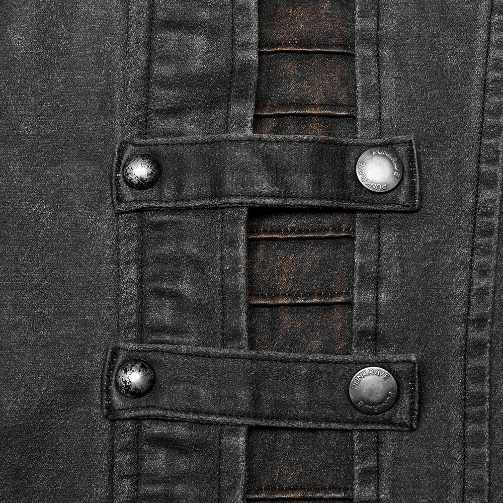 Close-up of rugged distressed faux leather jacket with decorative rivets and textured fabric details.