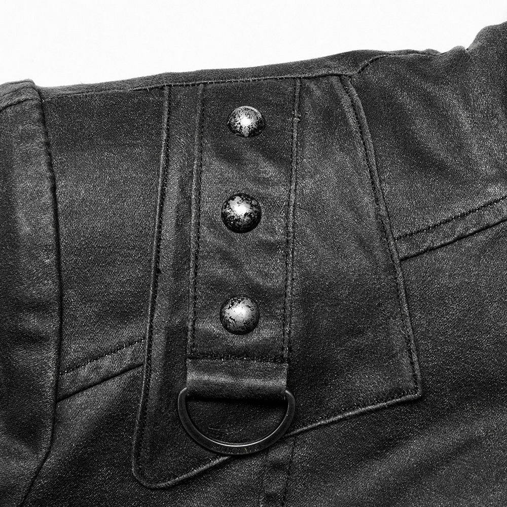 Close-up of stylish decorative rivets on the rugged leather-look urban jacket collar.