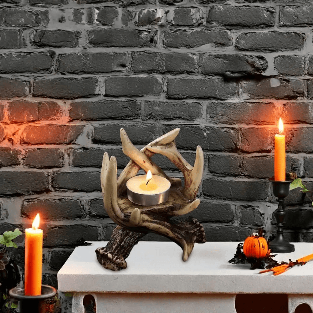 Rustic Antler Candle Holder for Gothic Home Decor featuring entwined deer horns with a tea light in a rustic setting.