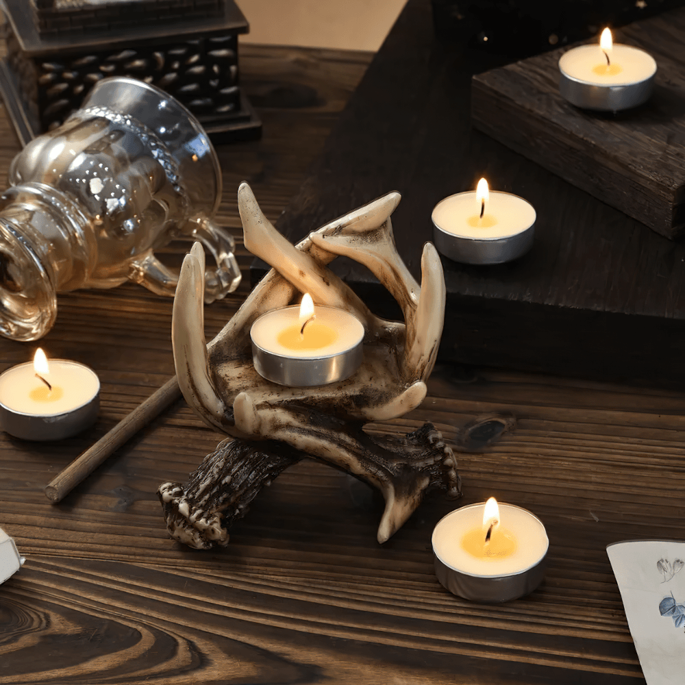 Rustic Antler Candle Holder for Gothic Home Decor with tea lights on a wooden table, creating a vintage ambiance.