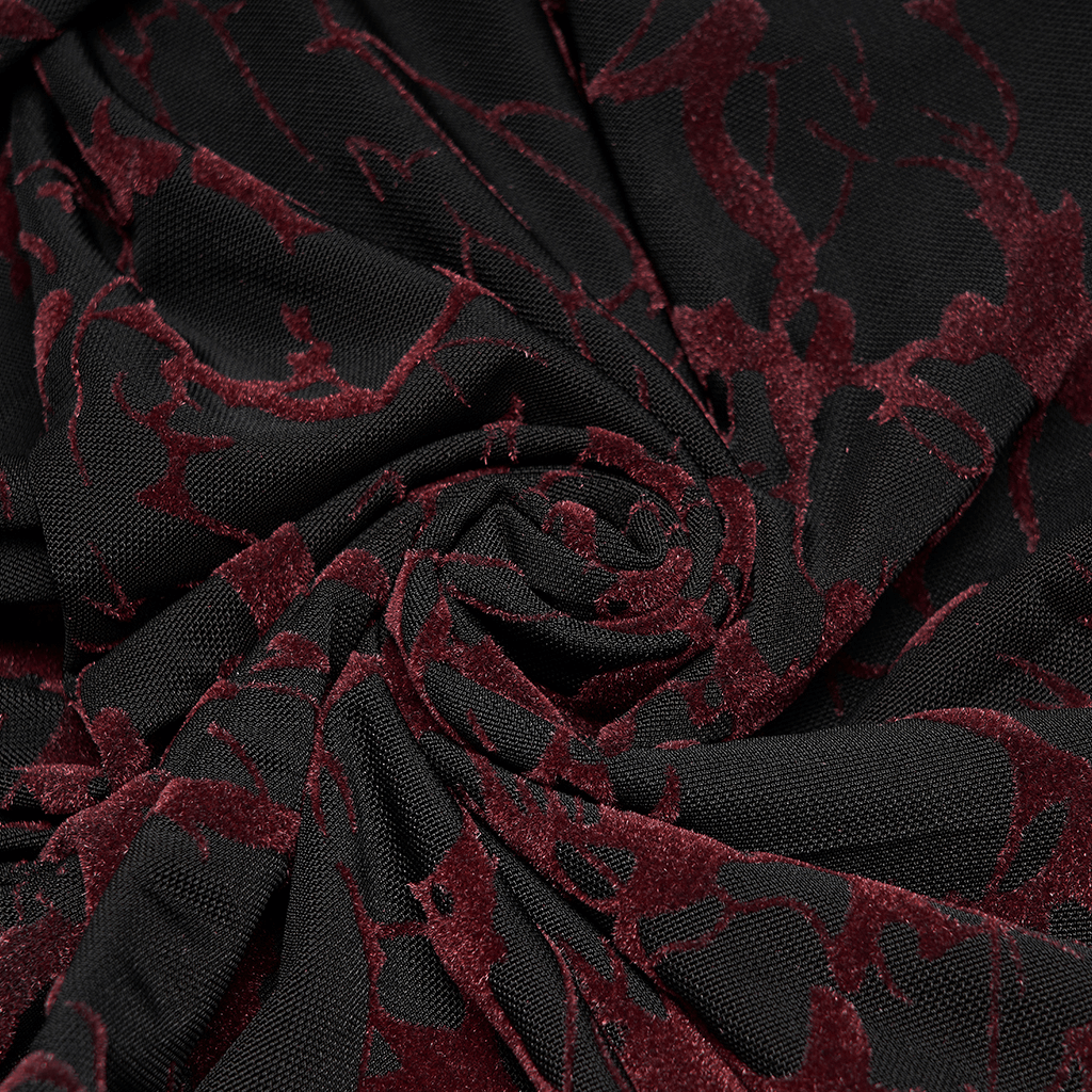 Close-up of scarlet abstract mesh fabric featuring a gothic pattern on black material.