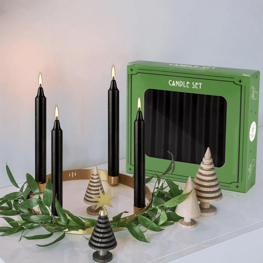 Elegant set of 10 black drip-free candles ideal for weddings and events, displayed with decorative trees.