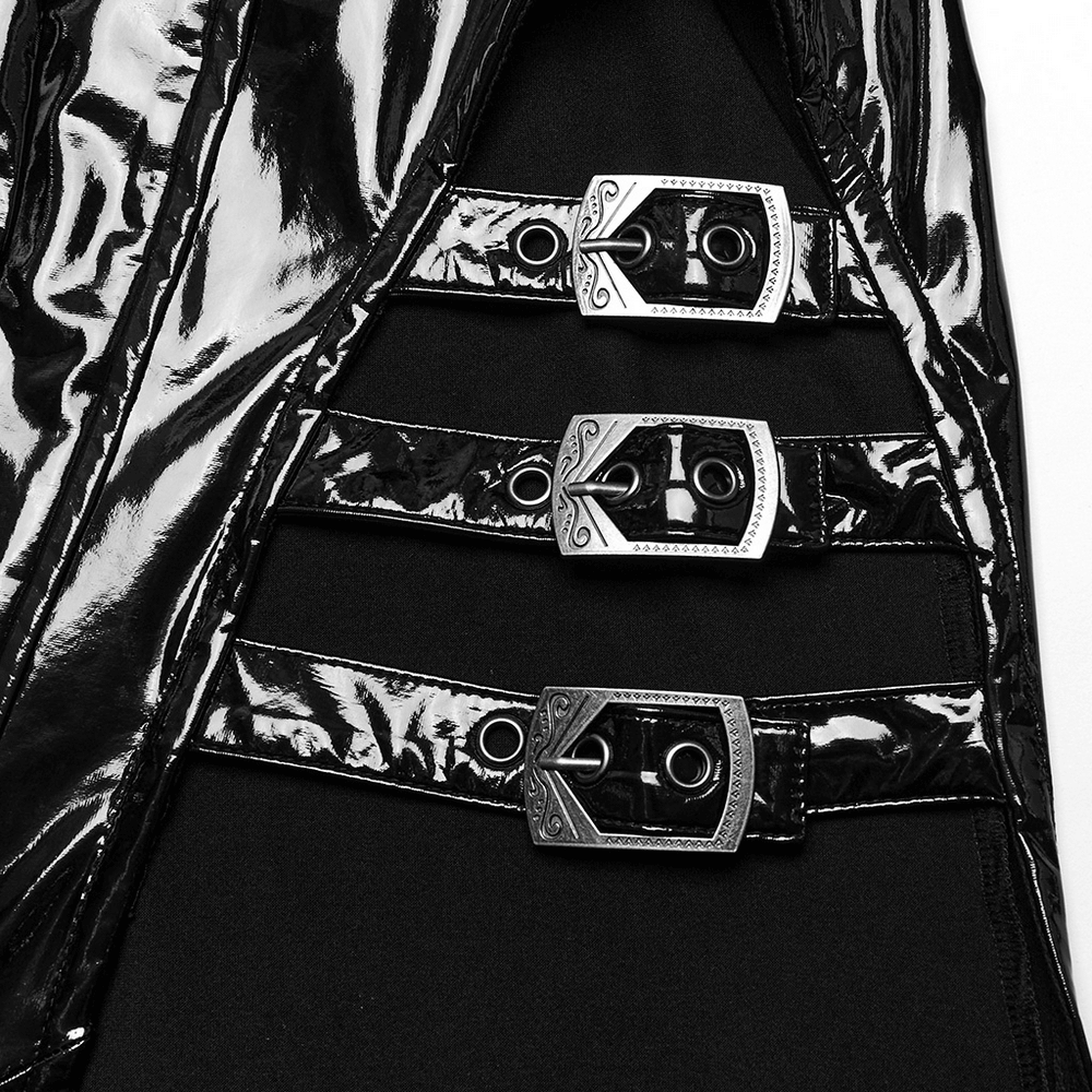 Close-up of thick metal buckles on glossy black faux leather dress, highlighting punk style and edgy design.